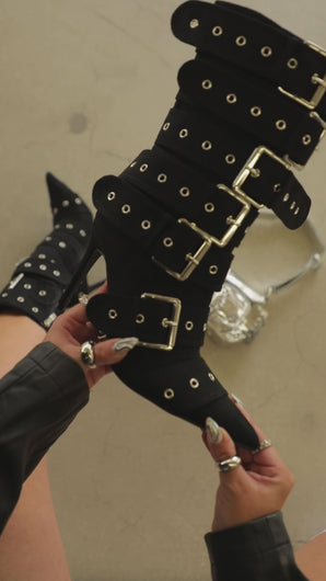 Video of stacked belt detailed boots