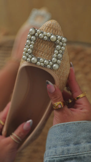 Video of pearl embellished flats 